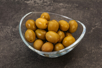 Green pickled olives in the bowl