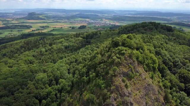 Aerial panoramic view over the long extinct volcanoes of the Hegau region towards Lake Constance in Germany.