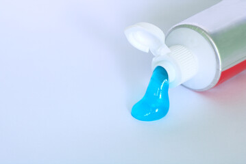 A tube of toothpaste. White background. Closeup.