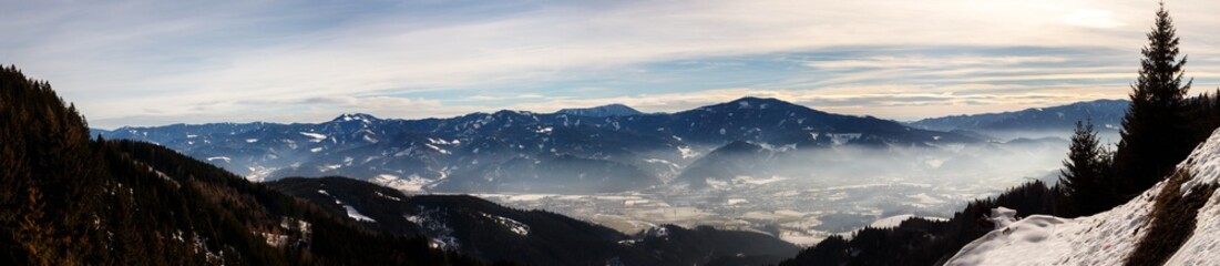 Plakat clear blue panorama in the austrian alps with clouds and fog on a cold winter day