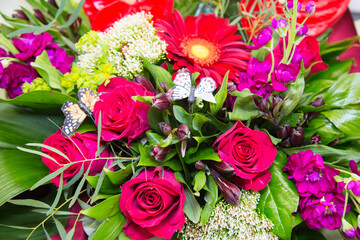 A bouquet of bright flowers roses gerberas irises, structures, and designs. Floriculture, agriculture.