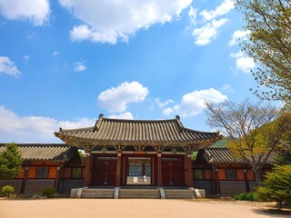 Traditional Korean gateway under a blue sky at daytime