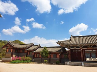 Fototapeta premium Traditional Korean buildings under a blue sky at daytime