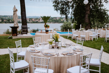 Beautiful pastel floral decoration for outdoor celebration by the river