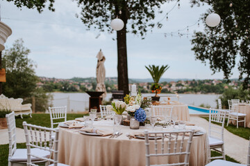 Beautiful pastel floral decoration for outdoor celebration by the river