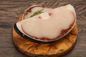 Raw shark steak served rosemary