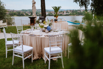 Beautiful pastel floral decoration for outdoor celebration by the river