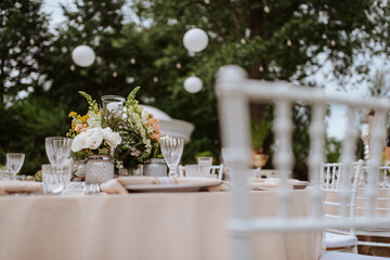 Beautiful pastel floral decoration for outdoor celebration by the river