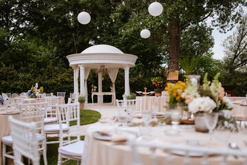 Beautiful pastel floral decoration for outdoor celebration by the river