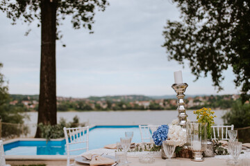 Beautiful pastel floral decoration for outdoor celebration by the river
