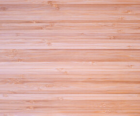 Light yellow beige surface of wooden background board.