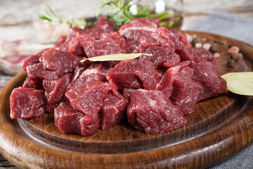 Beef stew prepared on a chopping board.