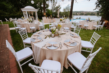 Beautiful pastel floral decoration for outdoor celebration by the river