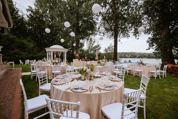 Beautiful pastel floral decoration for outdoor celebration by the river