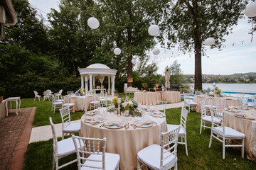 Beautiful pastel floral decoration for outdoor celebration by the river