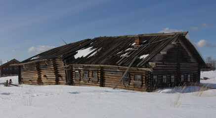 old village houses stand in the snow in the winter
