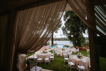 Beautiful pastel floral decoration for outdoor celebration by the river