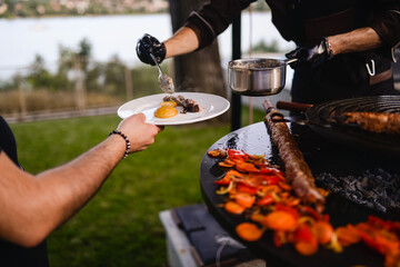 Minced meat kebab is baked. Barbecue and outdoor party