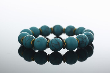 Close up of beautiful bracelet with turquoise stones. Handmade jewelry concept