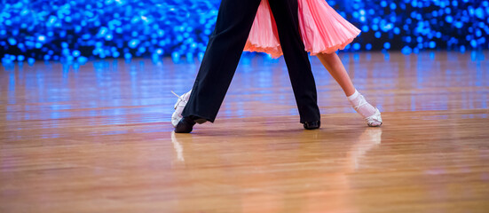 Attractive young couple of children dancing ballroom dance. Girl and boy dancer latino...