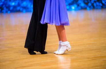 Attractive young couple of children dancing ballroom dance. Girl and boy dancer latino...