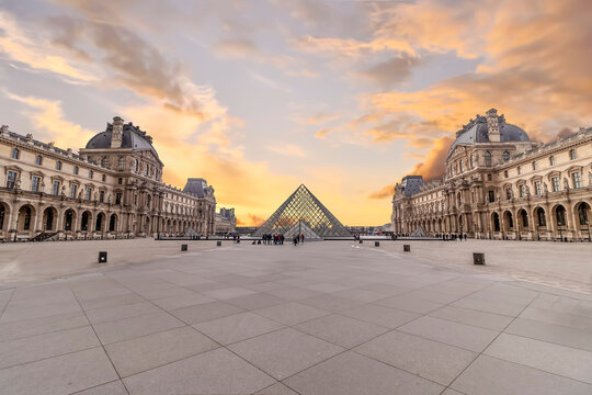 Paris, France - March 15, 2018: View of iconic Palace of Louvre and the pyramid of Louvre museum at sunset