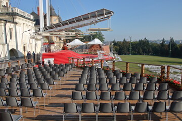Empty chairs prepared for belivers next to outdoor altar in Catholic sanctuary called Jasna Góra in Częstochowa, Poland © Wioletta