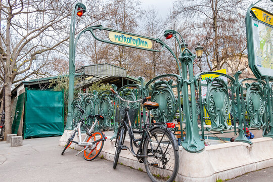 Paris, France - March 13, 2018: Bicycles parked in front of  Parisian metro station in rue de la Cite