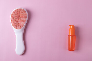 Obraz premium different hairdresser's items or haircare objects on pink background. minimalism style.