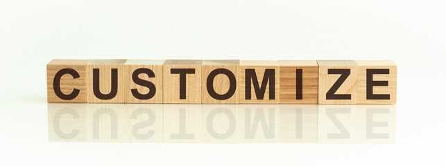word customize on wooden cubes on white background