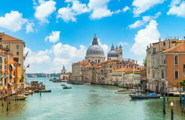Fototapeta premium Venice, Italy - june 29th 2020 - The quiet Grand Canal and the Basilica di Santa Maria della Salute seen from the Ponte dell Accademia bridge on a sunny Corona day in summer