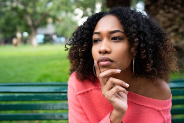 Afro american woman with thoughtful expression