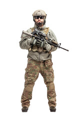 soldier in military equipment with a shotgun on a white background, commando in uniform with a weapon