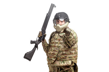 Fototapeta premium soldier in military equipment with a shotgun on a white background, commando in uniform with a weapon