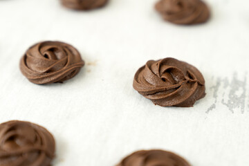 Homemade simple dark or brown chocolate cookies in baking tray