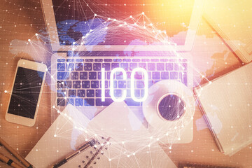 Blockchain theme hologram drawings over computer on the desktop background. Top view. Double exposure.