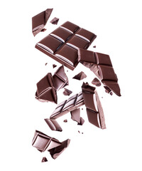 Bar of dark chocolate crushed in the air on a white background