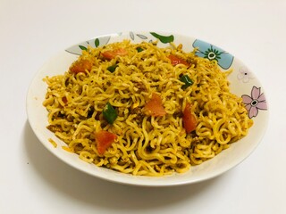Spicy noodles on white plate 