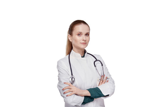 Beautiful young woman doctor in a white medical coat looking at the camera.