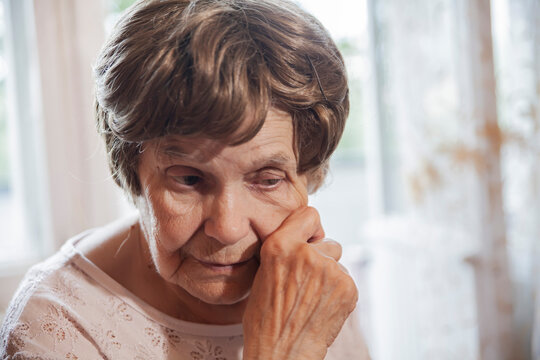 Portrait Of An Old Woman Thinking And Crying