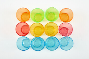 Top view on multi-colored glasses of glass. Caring for the environment.