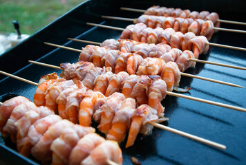 Bacon wrapped shrimp on grill