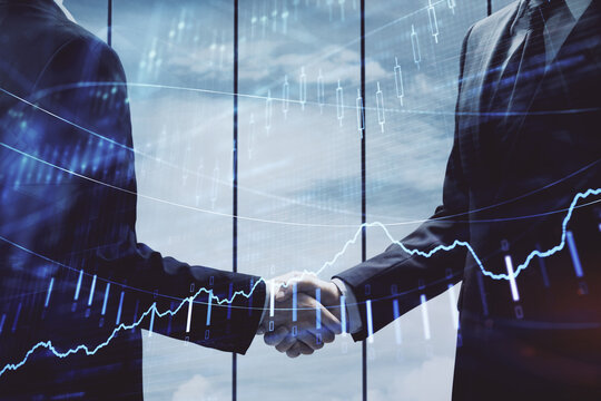 Double exposure of forex graph hologram and handshake of two men. Stock market concept.