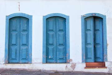 Fototapeta na wymiar Closeup shot of the exterior wall with blue wooden old doors