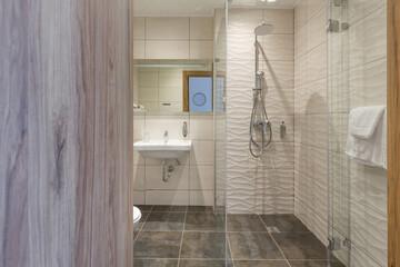 Interior of a hotel bathroom interior with shower cabin