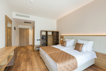 Fototapeta na wymiar Interior of a luxury hotel bedroom in mountain hotel resort