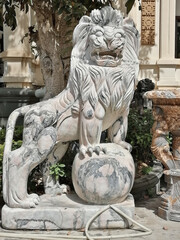 Vietnam, Da Nang - February 26, 2020: pink marble lion sculpture in the area of the Marble Mountains