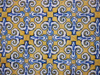 Traditional spanish ceramic tiles. Vintage pattern on the facade of the Central Market in Valencia. Colorful background. Flower ornament.
