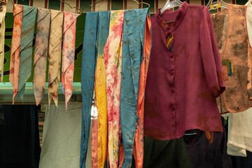 Closeup shot of dresses and scarfs in a flea market in Korea