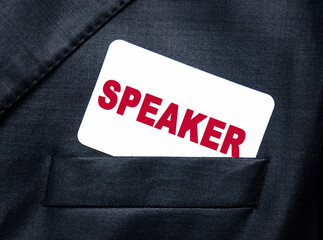 Business card with the words SPEAKER in the pocket of a black jacket of a businessman. Business concept.